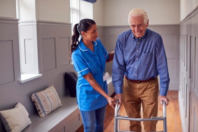 [fpdl.in]_senior-man-home-using-walking-frame-being-helped-by-female-care-worker-uniform_562859-3499_medium