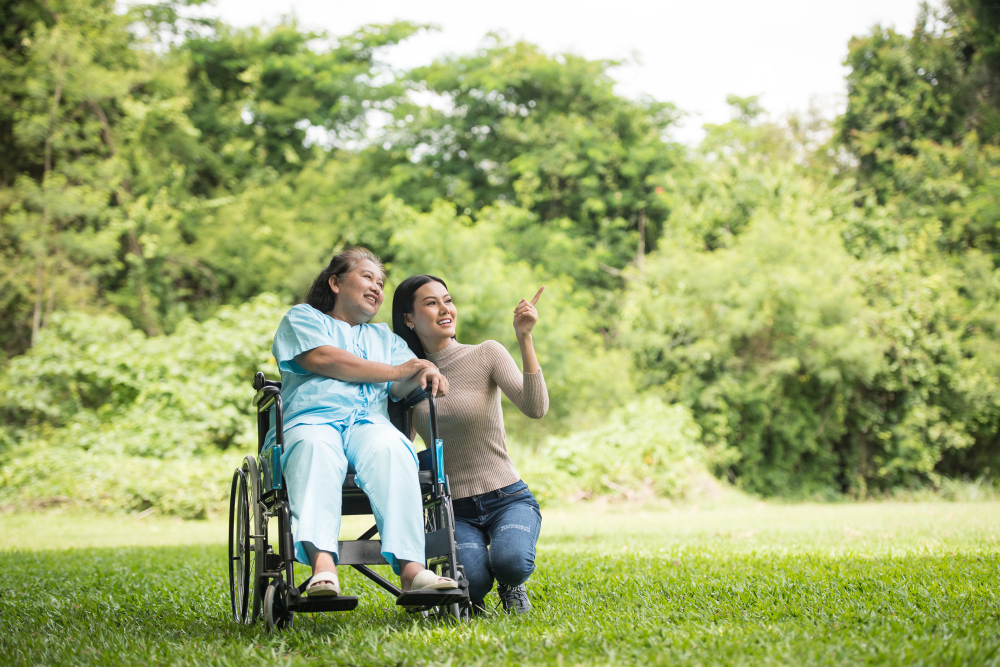 granddaughter-talking-with-her-grandmother-sitting-wheelchair-cheerful-concept-happy-family