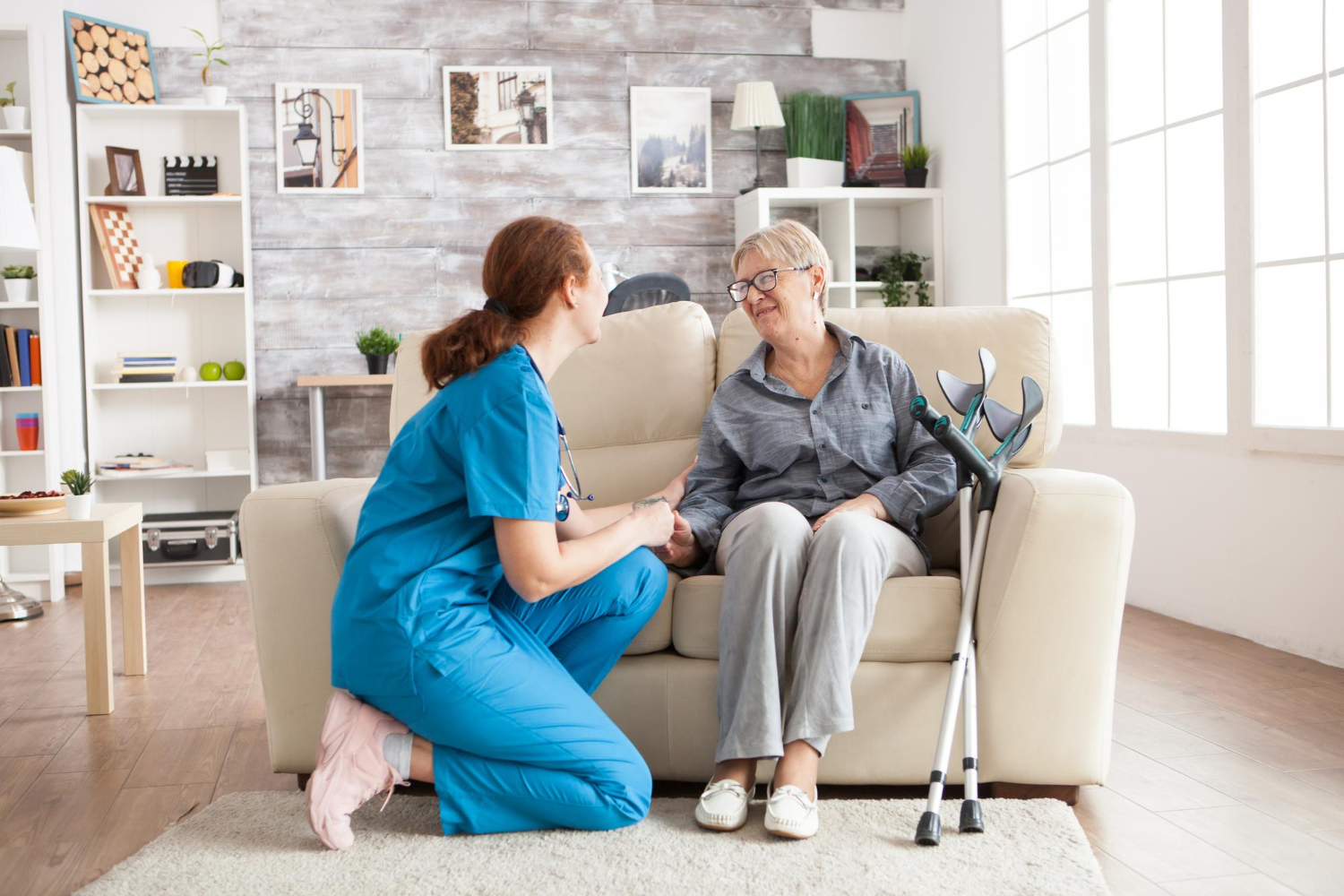 happy-old-woman-nursing-home-sitting-couch-talking