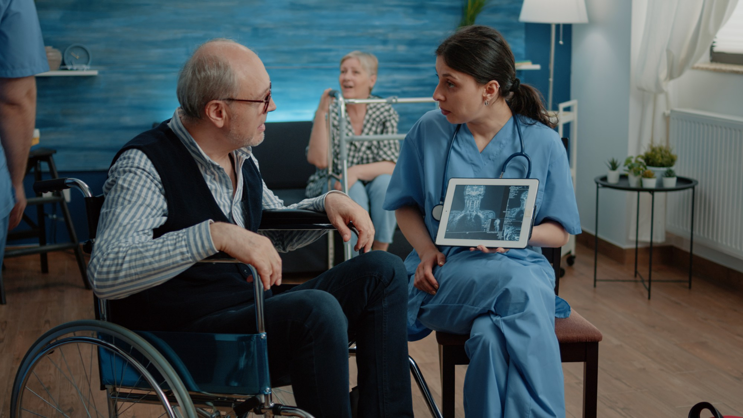 woman-nurse-with-x-ray-tablet-showing-scan-old-patient