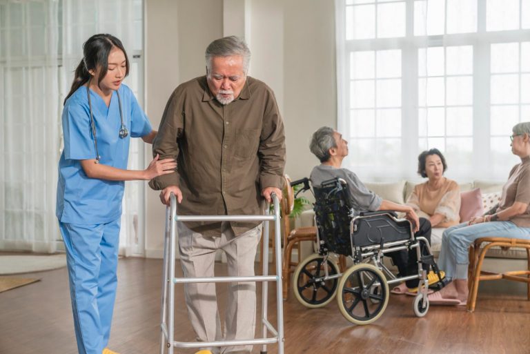 young-asian-female-nurse-care-giver-helping-asian-senior-old-man