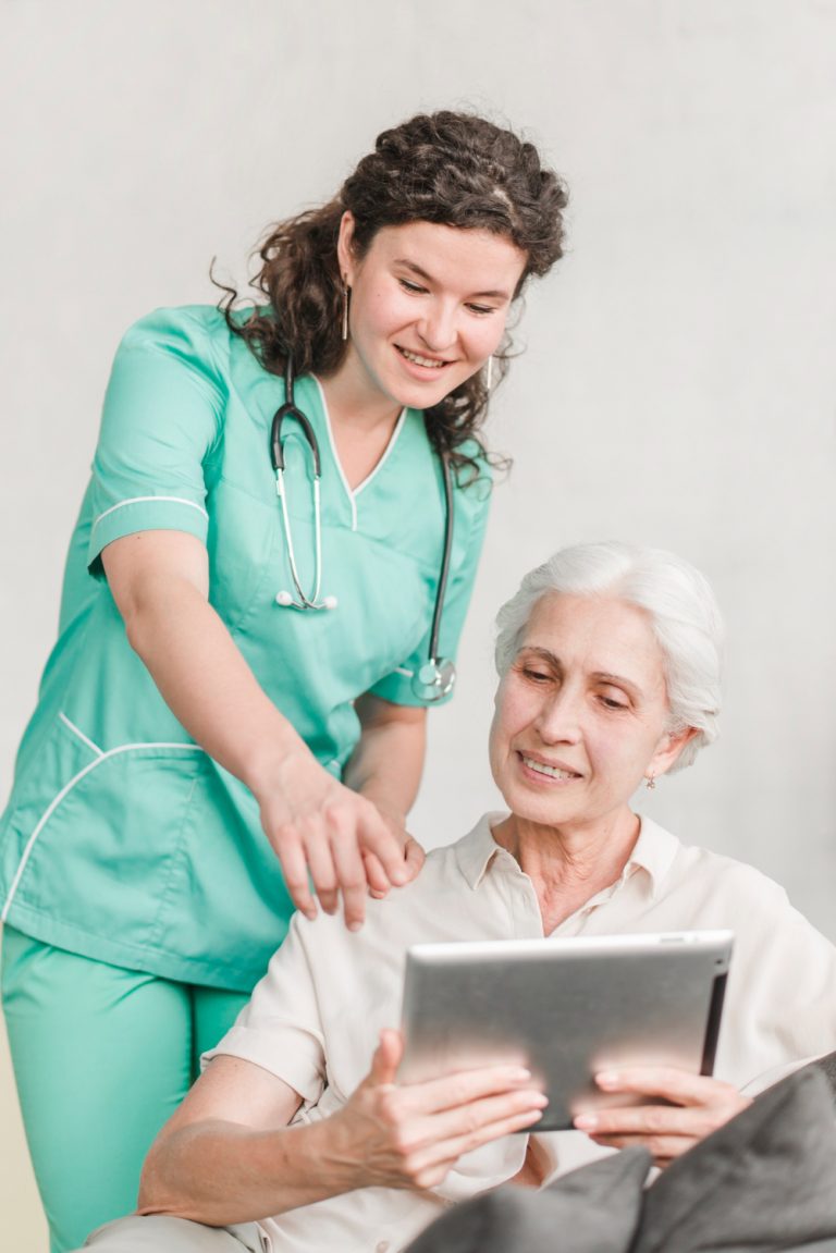 nurse-pointing-screen-showing-something-her-patient-digital-tablet